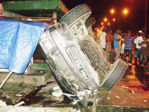 The Land-cruiser on its side on the sidewalk following the accident. 