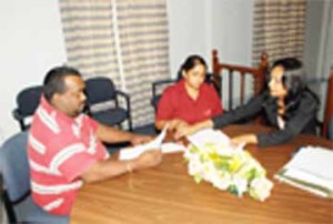 DFLSA officers interviewing a client