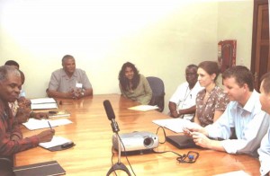 GT&T CEO Major General (ret’d) Joe Singh (centre, background) during a recent meeting here with a team from Global Marine Services Limited to discuss the Suriname Guyana Submarine Cable Project. Consultant Sonita Jagan is seated to Singh’s left.
