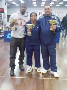 The victorious Guyanese team: From left, Idi Lewis, Diane Chance and Bruce Edwards display their trophies.   