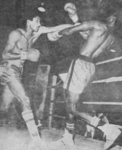 Winfield Braithwaite, left, on the attack against Derick `Teacher’ Mc Kenzie in their fight for the welterweight title of Guyana. The fight ended in a draw. 