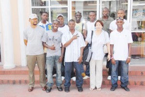 The Business School relay team prior to their departure for Barbados on Wednesday. Headmistress Cindy Bovell and Physical Education Teacher Sigmond Daniels stand second from right and far left respectively. 