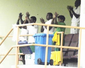 ‘Well done Darwin.’ Must be the words going through the minds of from left : Shemroy Barrington, Leon Johnson, Christopher Barnwell and Devendra Bishoo, as they applaud their teammate wicketkeeper/batsman Darwin Christian after he scored his maiden first class ton against Jamaica yesterday. (Photos by Aubrey Crawford)