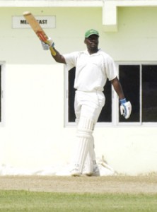 Guyana’s Darwin Christian acknowledges the applause of his teammates, after reaching his maiden first class century against Jamaica at the Guyana National Stadium, Providence yesterday.