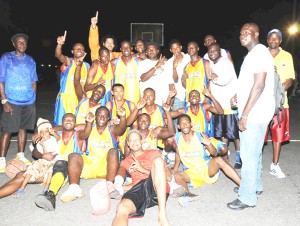  We are the Champions.  Courts Pacesetters players celebrating after winning the Kevin Worrell/Lens Craft third-division league championship. (Clairmonte Marcus photo)  