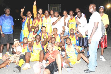  We are the Champions.  Courts Pacesetters players celebrating after winning the Kevin Worrell/Lens Craft third-division league championship. (Clairmonte Marcus photo)  