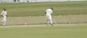  Jamaica’s first innings centurion Donovan Pagon looks back to see his stumps being dismantled by Esaun Crandon in his team’s second innings against Guyana at the National Stadium, Providence, yesterday. (An Aubrey Crawford photograph) 