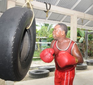 TIRING OUT! Clifford`Piggy’ Griffith works out on the vehicle tyre in preparation for his upcoming fight against Cecil  Alfred. (Clairmonte Marcus photo)    