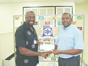 Daniel Fraser, left, Chairman of Region Eight receives the sponsorship cheque from George Mc Donald, Banks DIH Sales and Marketing Director.   