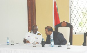 Commander-in-Chief, President Bharrat Jagdeo (right) speaking with Chief of Staff, Commodore Gary Best during yesterday’s opening session of the army officers’ conference. (Jules Gibson photo)