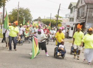 A ‘mashing’ time: The Ptolemy Reid Centre took to the streets around its Carmichael Street location on Friday with its Mashramani Parade. From the photo above great fun was had by all involved. (Photo by Aubrey Crawford)
