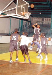 A GTI player goes up for a rebound during the final of the Schools’ Mashramani basketball competition against President’s College.(Aubrey Crawford)