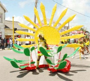 This Essequibo Islands/West Demerara costume depicted the ‘golden sunshine days’ for Guyana at yesterday’s annual Mashramani Float Parade. (Photo by Jules Gibson) 