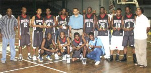 Minister of Sport Dr. Frank Anthony (center) and the victorious GTI team. Also in photo, Parliamentary Secretary Steve Ninvalle (extreme left) and Director of Sport Neil Kumar (extreme right) – (Aubrey Crawford photo)  