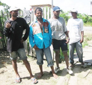 Mohanlall’s brothers from right to left: Mohan, Chetram and Mahendra with Shiwpersaud’s brother, Latchman after they returned from an unsuccessful search yesterday.  