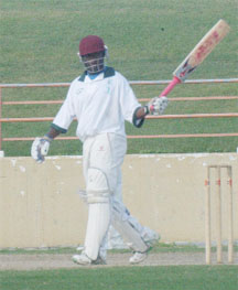 Windward Islands’ Donwell Hector acknowledges the applause of his teammates after reaching his maiden first class 50 against Guyana at the Guyana National Stadium, Providence yesterday. (An Aubrey Crawford photograph)   