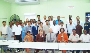 Neal and Massy Group CEO Deo Persaud (sitting fourth from right) with the inductees and company officials.  