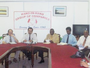 CEO of the Hand-in-Hand Group of Companies, Keith Evelyn (2nd from left) is flanked by (from left) Chairman of Hand-in-Hand Trust Corporation, Paul Chan-A-Sue; Hewley Nelson, General Manager and Director of Hand-in-Hand Trust; Taj Parmessar, Finance Controller of the Corporation and Maurice John, Deputy General Manager and Corporate Secretary.   