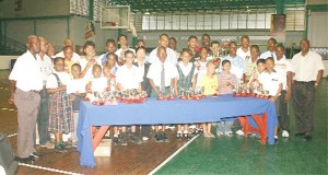 Prize winners of the National Sports Commission (NSC) sponsored Mashramani table tennis tournament and officials of the Guyana Table Tennis Association and NSC after the presentation of prizes on Wednesday at the Cliff Anderson Sports Hall. (Orlando Charles photo)   