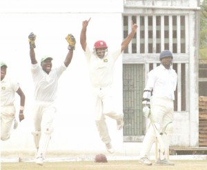 FIRST BLOOD! The Guyana team celebrate the dismissal of opener Kyle Corbin who was caught by wicketkeeper Darwain Christion, centre, off the bowling of Christopher Barnwell for 16. (Aubrey Crawford photo)