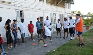 Getting it right! GHB president, Philip Fernandes, (extreme right) pays keen attention as this participant executes a drill at Saturday’s workshop. (Clairmonte Marcus Photo)   