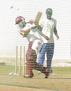 ‘Ahh, that’s how he does it.’ These must be the words going through the mind of the gentleman at the back of the nets, as the inform Ramnaresh Sarwan executes a drive. (Photographs by Aubrey Crawford).   