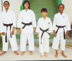 The new brown belt karatekas, from left, are  Shaquille Sobers, Yogini Maharaj, Michael Phang and Joshua Broomes.   