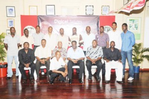 In this Clairmonte Marcus photo,  Clive Lloyd (3rd from right) and Lance Gibbs (4th from left) strike a pose with, from left, Alfred Mentore, Roger Harper, Mark Harper and Garvin Nedd, all stalwarts of Demerara Cricket Club, as well as other club members who are standing behind.