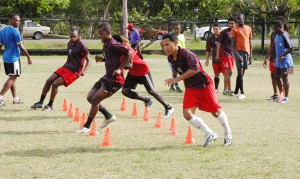 Alpha players going through their paces at the club’s final practice session at the Carifesta Sports Complex ground recently. The players seen in the forefront are Howard Lowe, Abasi McPherson, Edison Gomes and Emrick Williams (Aubrey Crawford photo) 