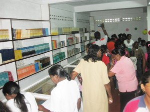  Persons viewing books in the library after the opening ceremony.  