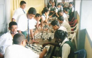 The West Demerara Secondary school held a Mashramani chess tournament in February in which two dozen students participated. School teacher and chess coach Vishnu Rampersaud said the students were enthused by the National Schools Championship in December and have since taken a strong interest in the game. The school is to field a small team of its strongest players to meet with McKenzie High shortly. Last Sunday, Rampersaud was elected a committee member of the Guyana Chess Federation. In photo, some students play their games during the Mashramani tournament.