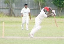 Georgetown’s Quincy Ovid-Richardson plays forward in his sterling innings against East Coast in the DCB Inter-Association Under-19 Competition yesterday at the Lusignan Community Centre ground. (Orlando Charles photo)