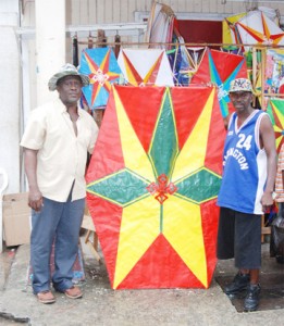 Kite vendor Keith Naughton (left) with his mega kite. He has been in the business for over 40 years.