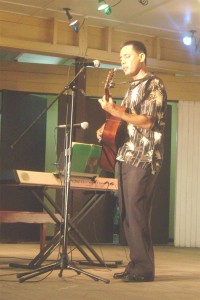 Feeling the love: Accompanied by his guitar, Romel De Souza croons ‘Can you feel the love tonight’ from the movie ‘The Lion King’ as the Guyana Music Festival continued at the Bishops’ High School last evening.