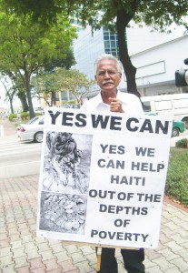 Trinidadian Ishmael protesting the plight of Haitians prior to the opening of the Fifth Summit of the Americas today.  