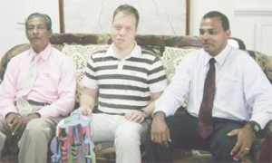 German Grand Master Rainer Buhmann (centre) sits with Minister of Culture, Youth and Sport Dr. Frank Anthony (R) and President of the GCF Errol Tiwari yesterday in the office of the Minister.     