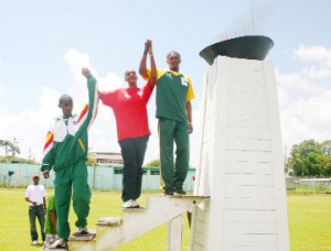 Athletes from French Guiana, Suriname and Guyana depicting the unity the IGG games espouse after the games torch was lit yesterday. (See sports pages) (Orlando Charles photo) 