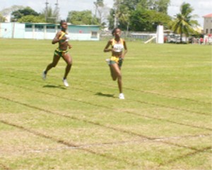 Home Alone! Guyana’s Jevina Straker (R) and Janella Jonas (L) storm home unchallenged in their IGG 1500m race at the Eve Leary Sports Complex ground, yesterday. (Orlando Charles photo)   