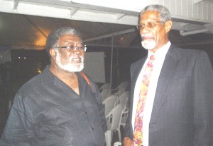 Vice-Chancellor of the University of Guyana, Lawrence Carrington (right) speaks with Dr. Ian Robertson of the University of the West Indies following an evening in honour of Guyanese writer Wilson Harris at the Georgetown Club on Sunday.    