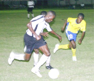 Milo Under-21 action! These two Camptown players (in white) on the attack against this Pele defender at right in their final match up at the Tucville Playfield last evening. (Orlando Charles Photo) 