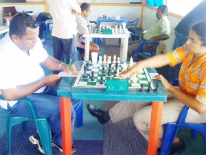 The annual Kei-Shar’s sponsored chess tournament is currently being contested at the Kei-Shar’s Sports Club on Hadfield St. After three rounds of the eight round swiss system tournament, National Champion Kriskal Persaud and Dennis Dillon share the lead with the maximum three points. The highlight of last Sunday’s play was the clash between Persaud and Taffin Khan, Guyana’s junior chess champion. The two champions met previously during the DDL Topco Juice Mashramani chess tournament when Taffin overwhelmed his opponent with a series of good moves. This time, however, Kriskal played less exuberantly and kept a clear head to win the game and take the full point. Dillon, on the other hand, played impressively to defeat Webster and his other opponents. The three final rounds of the tournament will be played today at the Kei-shar’s Sports Club.