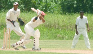 Georgetown’s middle order batsman Delon Fernandes executes a drive off the front foot during his 33 against West Demerara yesterday at the Everest Cricket Club ground. (An Orlando Charles photo) 
