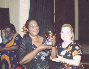Guyana Music Festival Overall Champion Gem Rohlehr-Vogt (left, with trophy) poses with Adjudicator Marilynda Lynch of Oral Roberts University at the Bishops High School Auditorim. 
