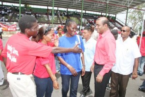 President Bharrat Jagdeo greeting workers at the National Park. (GINA photo)