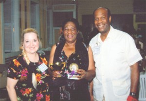 Guyana Music Festival Overall Champion and Best Adult Vocalist Gem Rohlehr-Vogt is flanked by Adjudicators Marilynda Lynch (left) and Don Ryan (right) of Oral Roberts University at the Bishops High School Auditorim. 