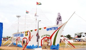 A replica of the Whitby, which brought the first indentured Indians to Guyana set up at the Guyana National Stadium, Providence yesterday as the Dharmic Sabha held its mela in commemoration of Arrival Day. (Photo by Jules Gibson)