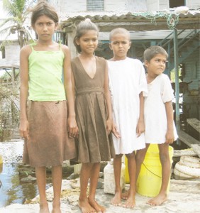 Anita Pooranmal and her three siblings at Pine Ground, Mahaicony Creek before they were removed by officials of the Human Services Ministry 
