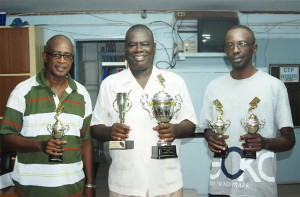 From left: Michael Vaughan, Clarence Whitehead and Brian Edwards pose with their spoils from the three-man competition.  