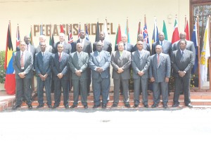 The 18 commissioners of police attending the 24th conference of the Association of Caribbean Commissioners of Police stand in front of the Pegasus Hotel where the conference is being held. (Photo by Jules Gibson) 