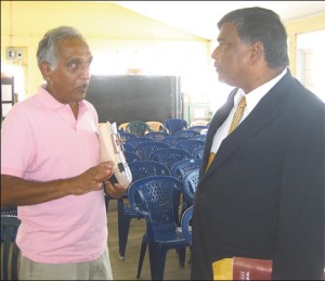 Concerned Member Christopher Ram speaking to NBS Chairman, Dr Nanda Gopaul (Stabroek News file photo) 